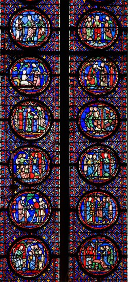 Interior of Sainte-Chapelle showing detail of medieval stained glass window panels Paris France Europe EU
